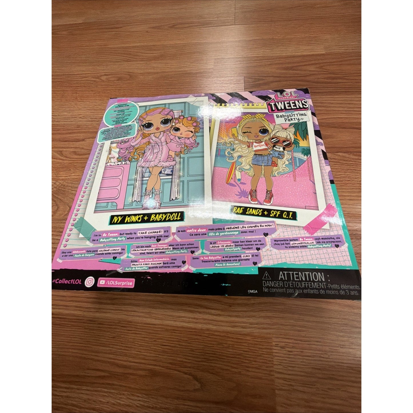 Flat lay of a colorful cardboard display featuring LOL Surprise Tweens dolls with vibrant clothing and accessories, placed on a wooden floor surface.