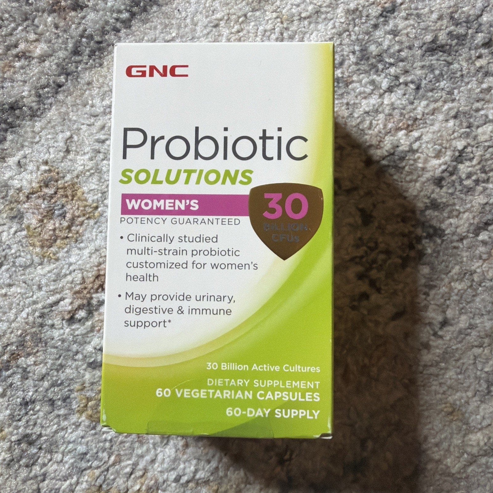 Box of GNC Probiotic Solutions Women's dietary supplement featuring 30 billion active cultures, multi-strain probiotics for urinary, digestive, and immune health in 60 vegetarian capsules.