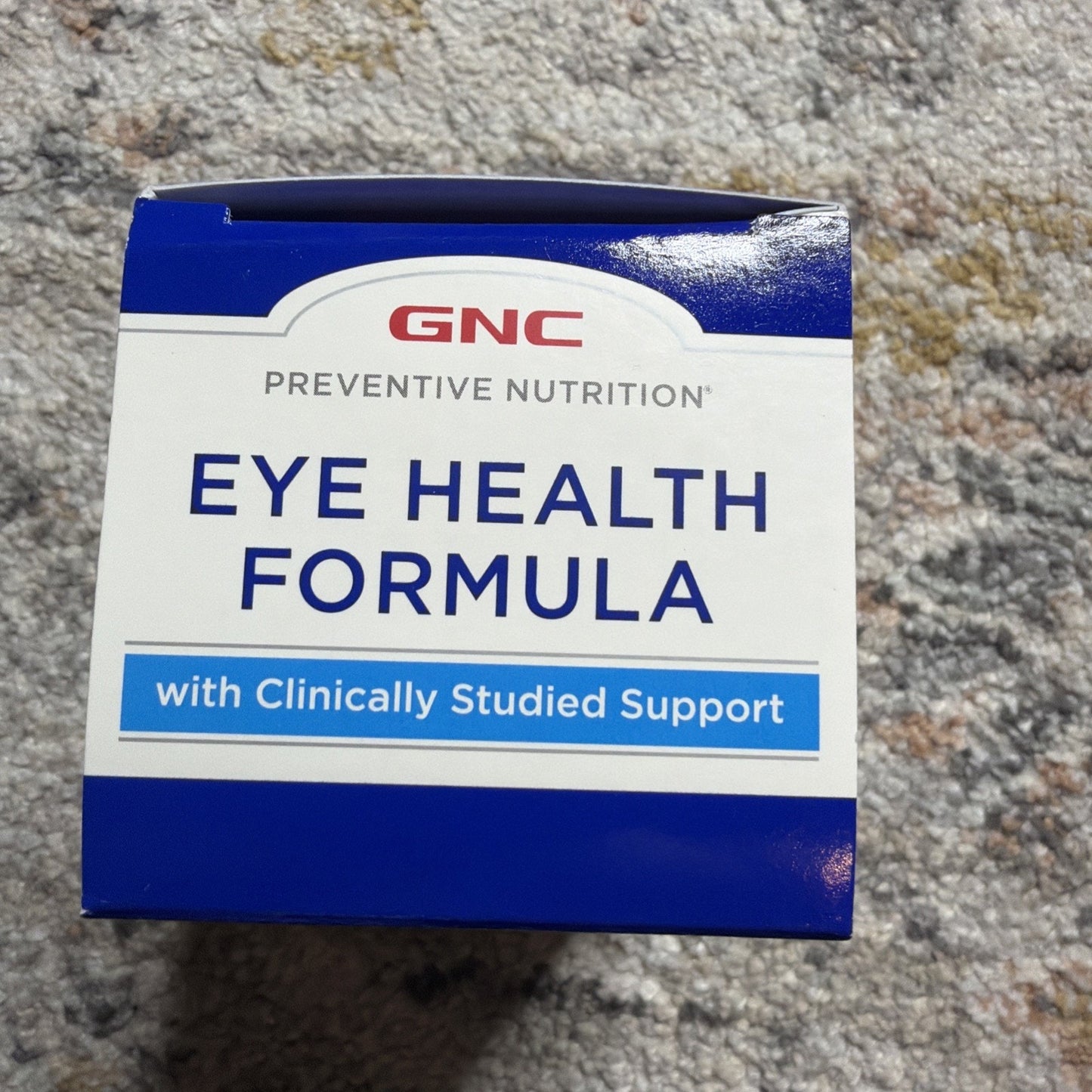 Box of GNC Preventive Nutrition Eye Health Formula supplement featuring a blue and white label highlighting clinically studied support for eye health.
