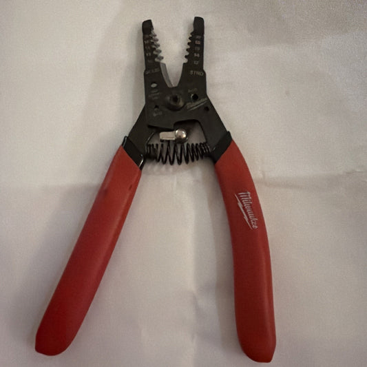 Milwaukee Automatic Wire Stripper with red handles for stripping 10 to 20 AWG wire sizes showing tool details