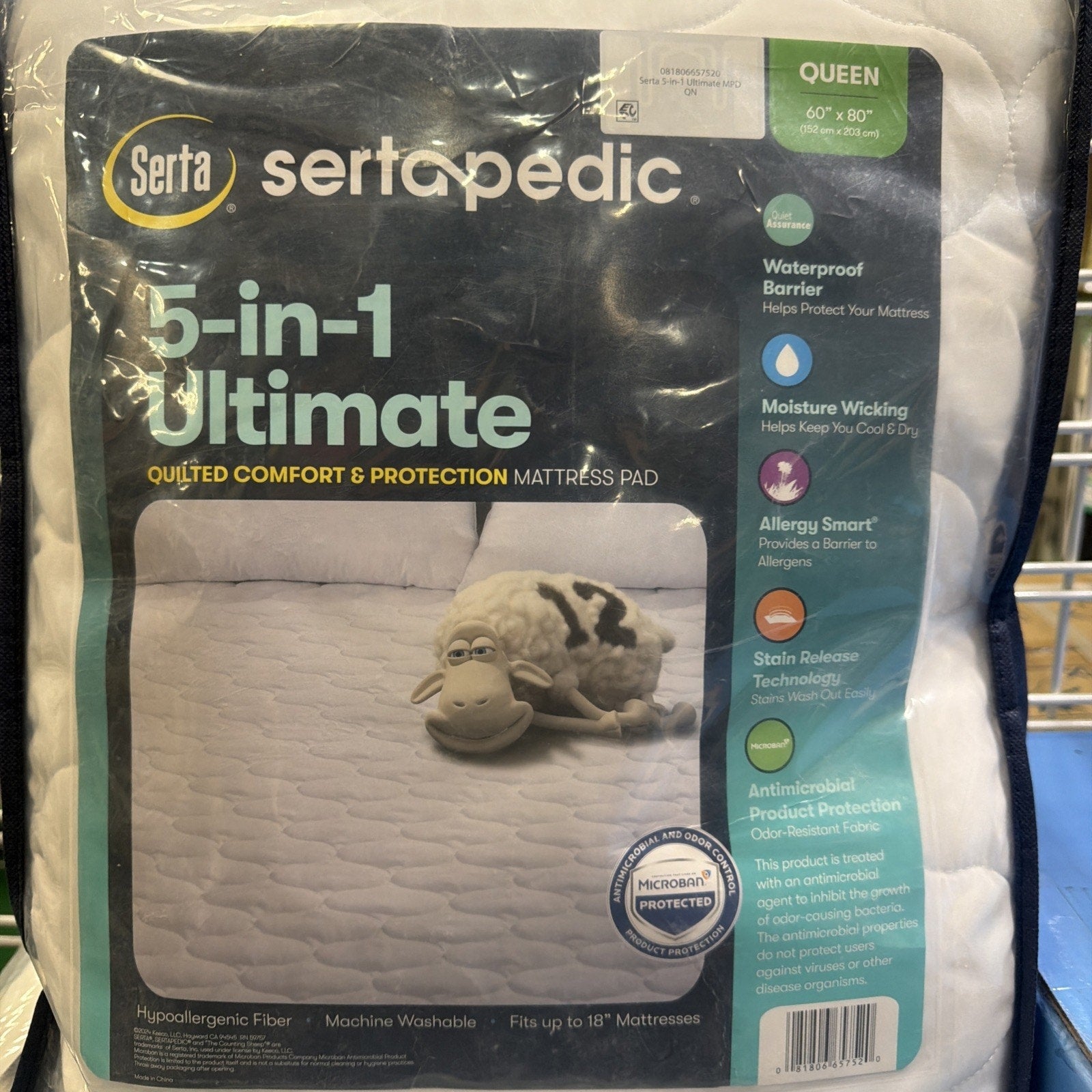 Packaging of a Serta mattress pad featuring 5-in-1 protection with waterproof barrier, moisture wicking, allergy defense, stain release, and antimicrobial fabric, for queen-size beds up to 18 inches thick.