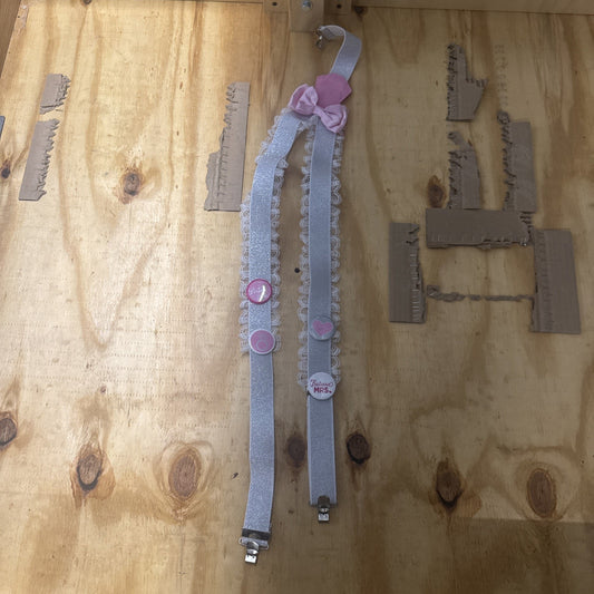 Bride future Mrs. bachelorette party garter suspender with pink bow and decorative pins on lace straps