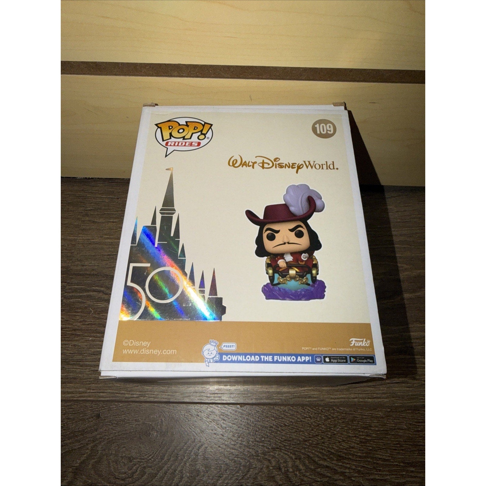 Funko Pop! Rides collectible figure of Captain Hook from Walt Disney World, featuring a stylized design and packaging celebrating the 50th anniversary event.