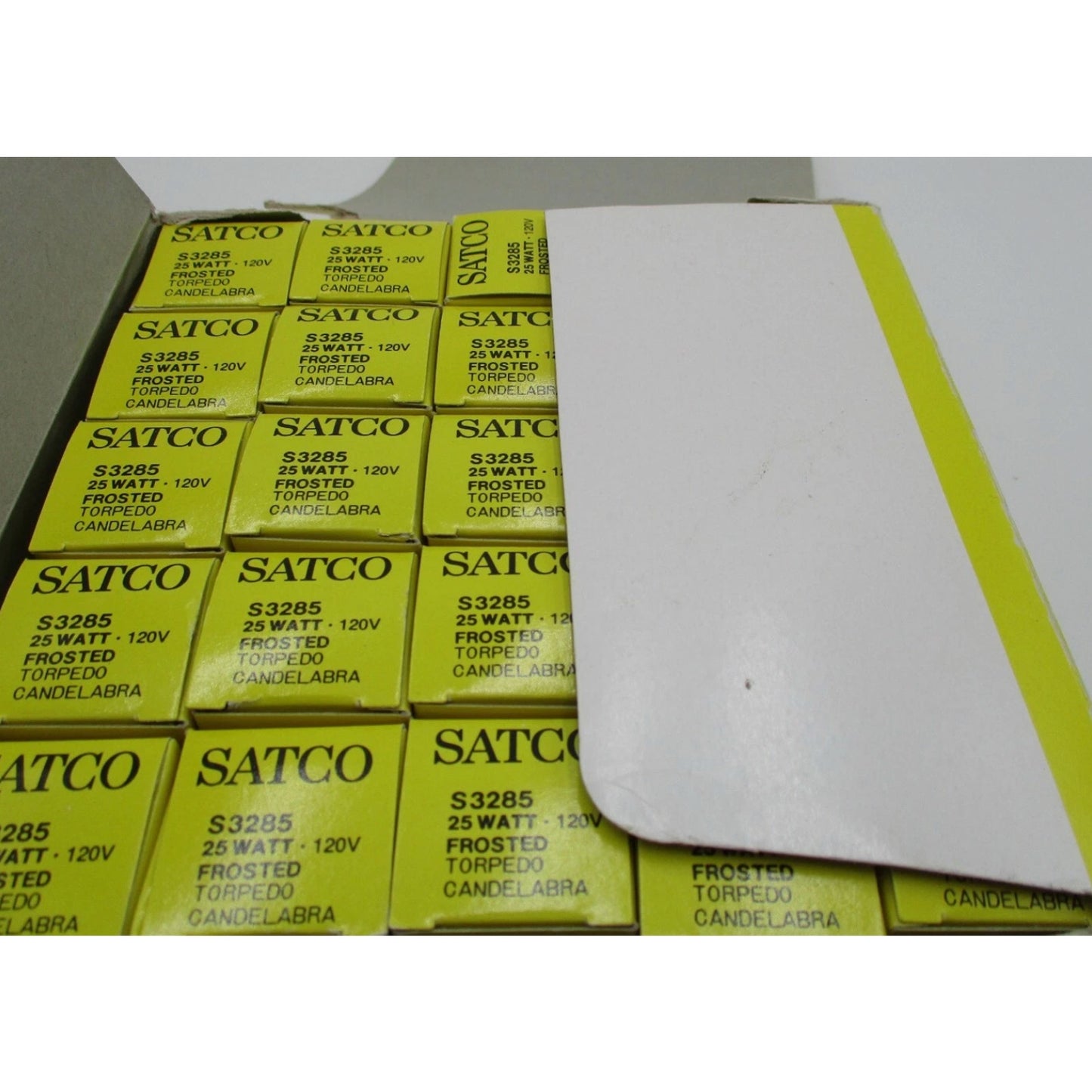 Pack of Satco 25W frosted torpedo candelabra base light bulbs in yellow and white retail packaging