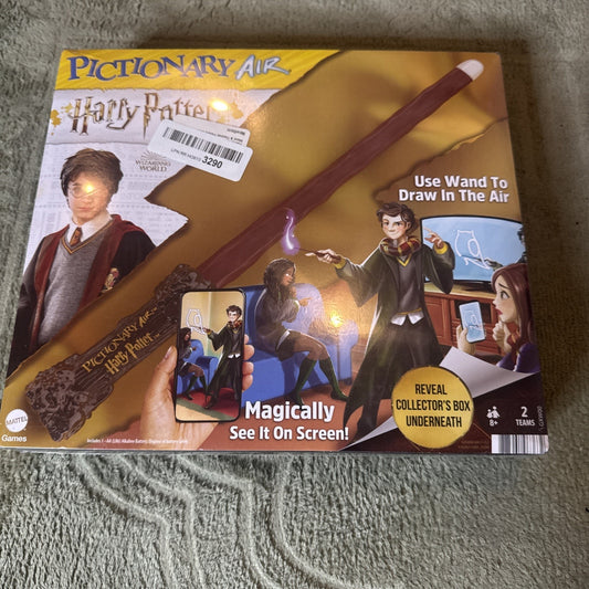 Pictionary Air Harry Potter Wizarding World family drawing game box with wand and magical drawing features shown