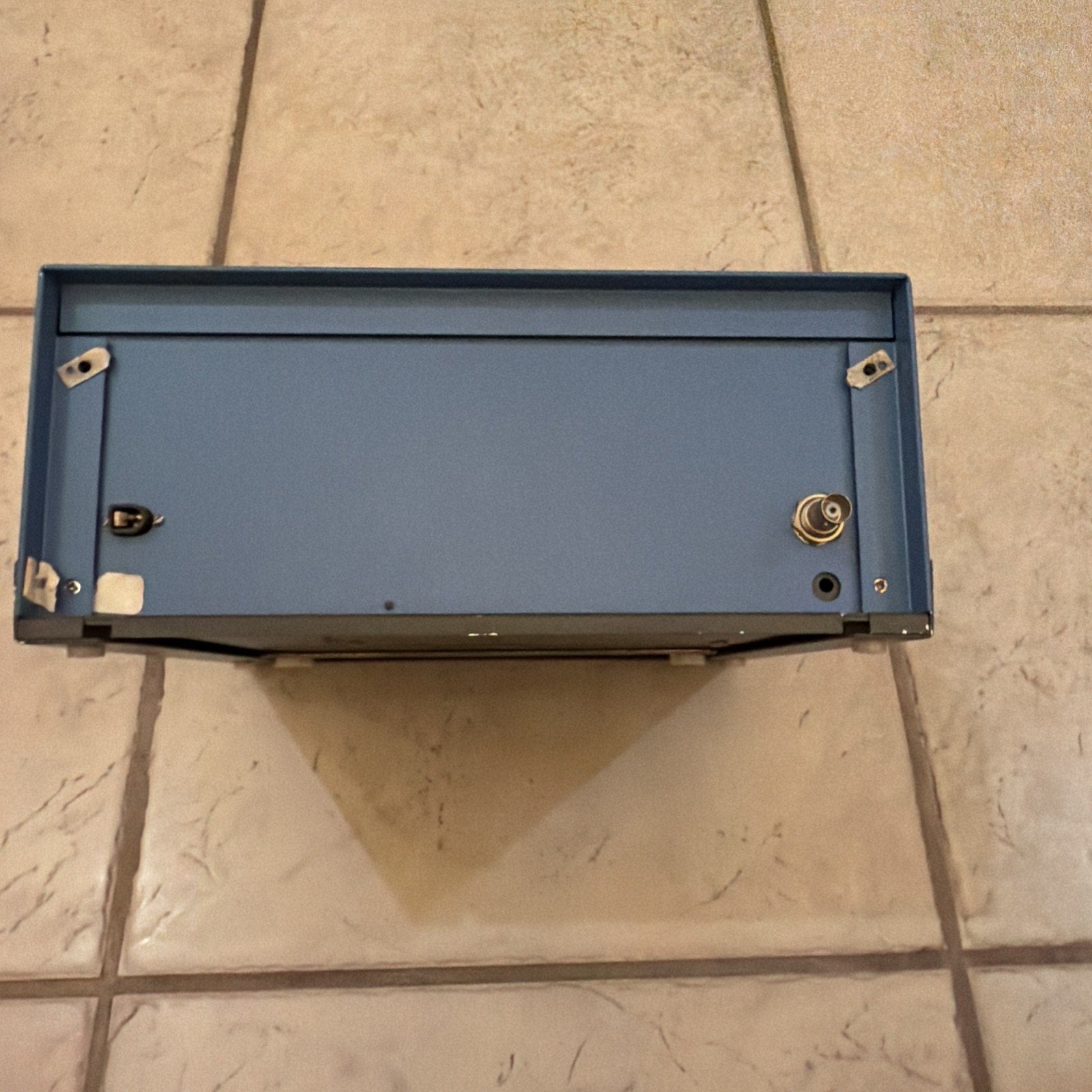 Cybermedics STENOMETER cardiology lab instrument unit shown from top with blue metal casing on tile floor