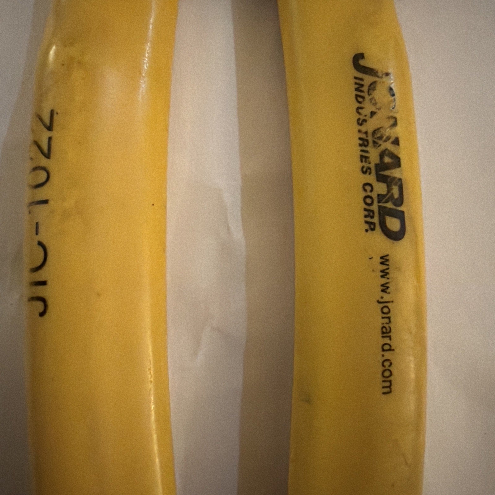 Jonard JIC-1022 wire stripper cutter handles in yellow with model number and company logo visible