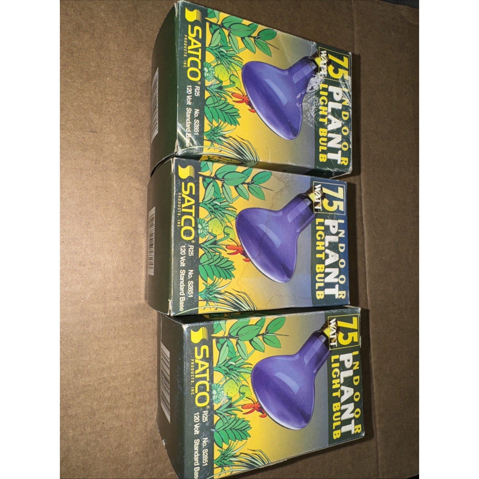 Three Satco S2851 75 watt blue R25 medium base plant light bulbs in original green and yellow packaging