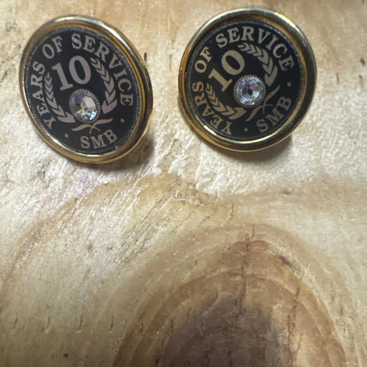 Set of two 10 Year Service SMB gold tone employee award pins with black background and clear gem center
