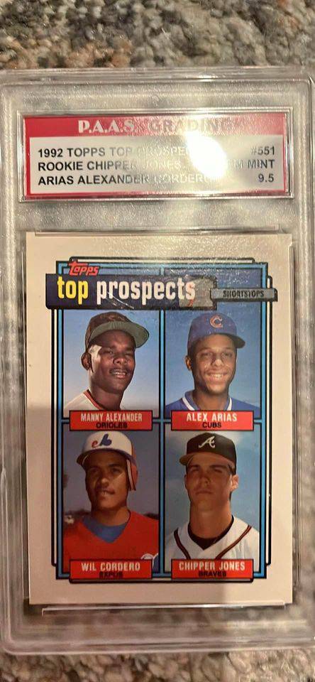 1992 Topps Rookie Card featuring Chipper Jones and other top baseball prospects in protective case.
