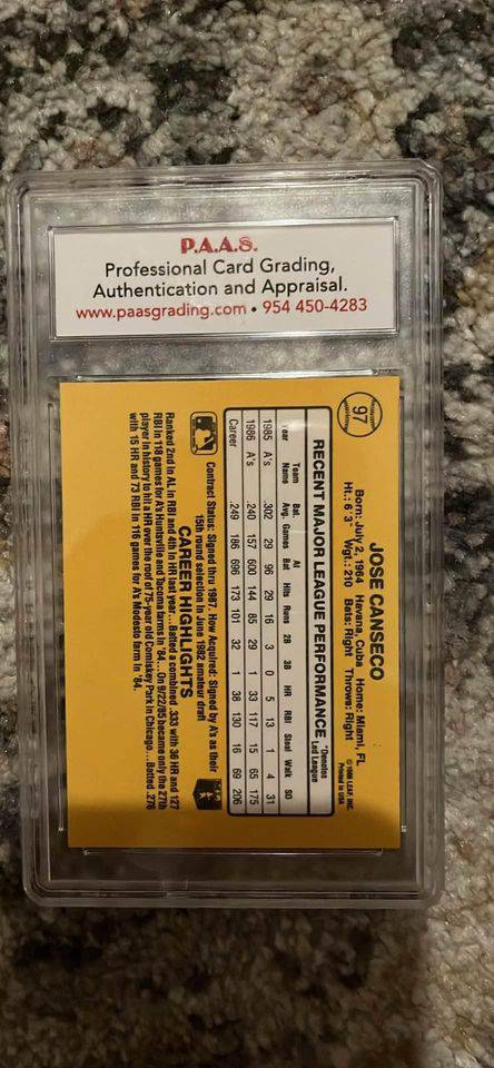 Jose Canseco baseball card graded 97 by P.A.A.S with career highlights and statistics on yellow background.