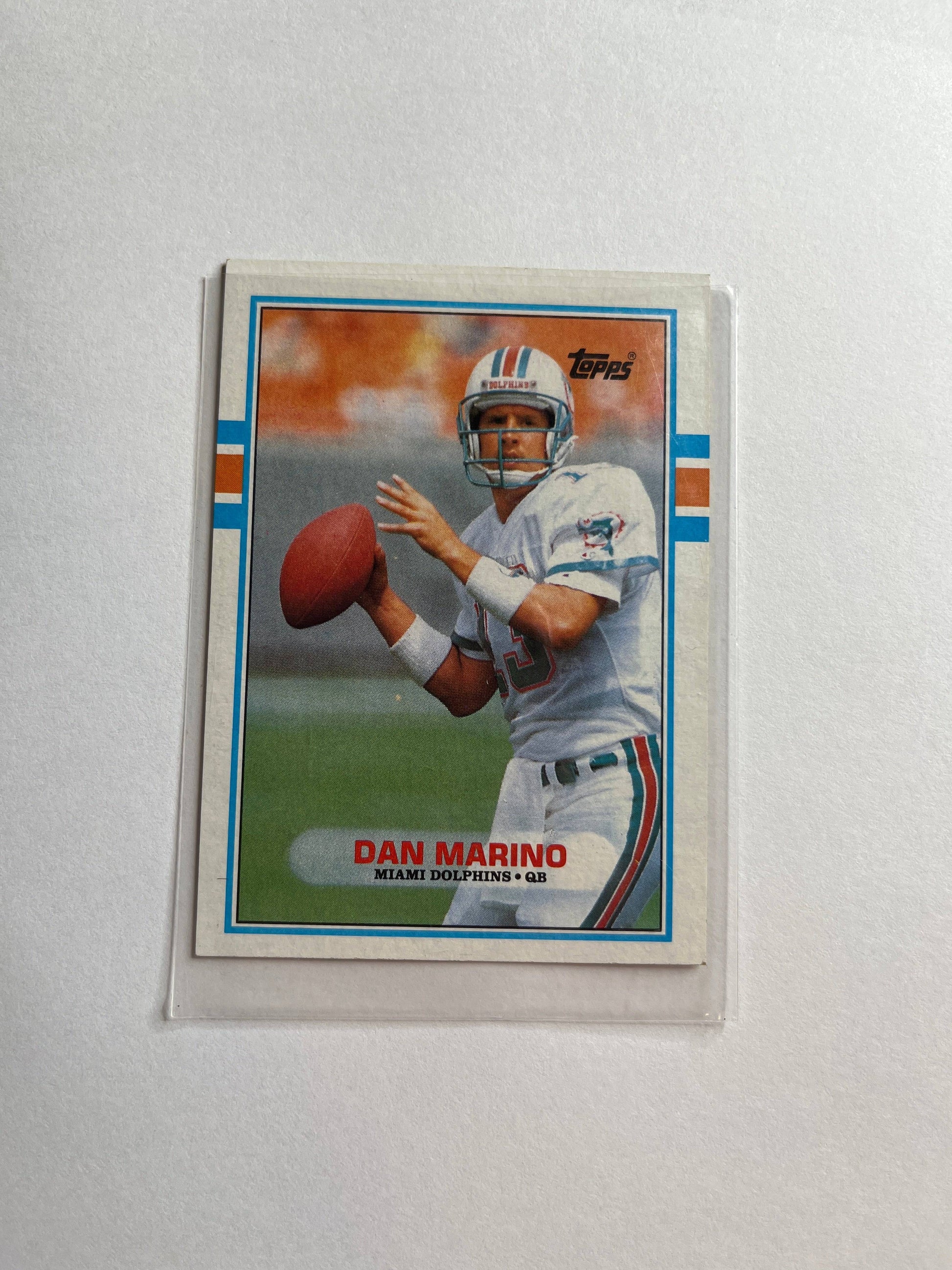 1990s Dan Marino Miami Dolphins football card by Topps showing Marino preparing to throw a pass