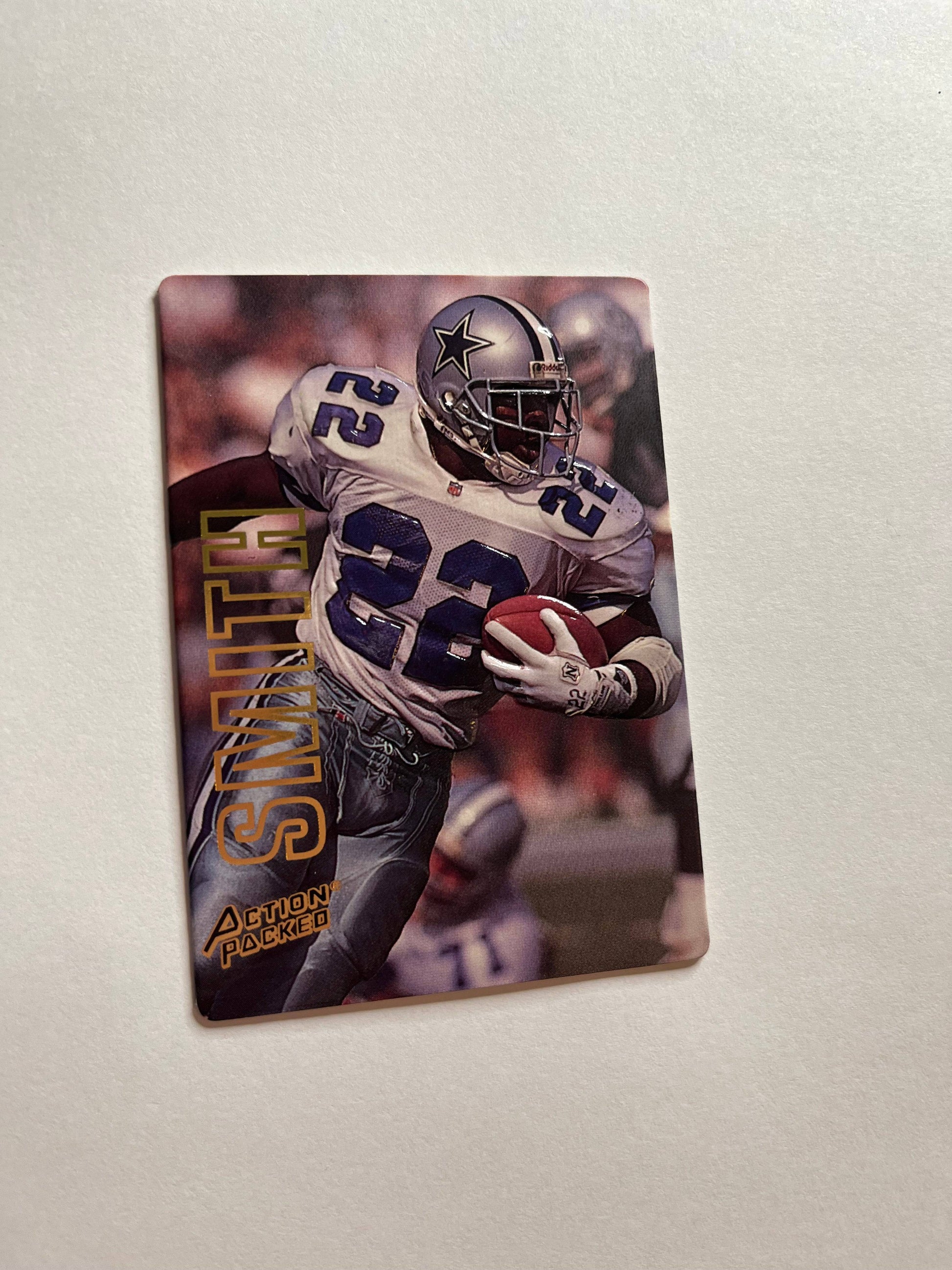 1993 Emmit Smith Dallas Cowboys football card with Action Packed logo showing him running with ball