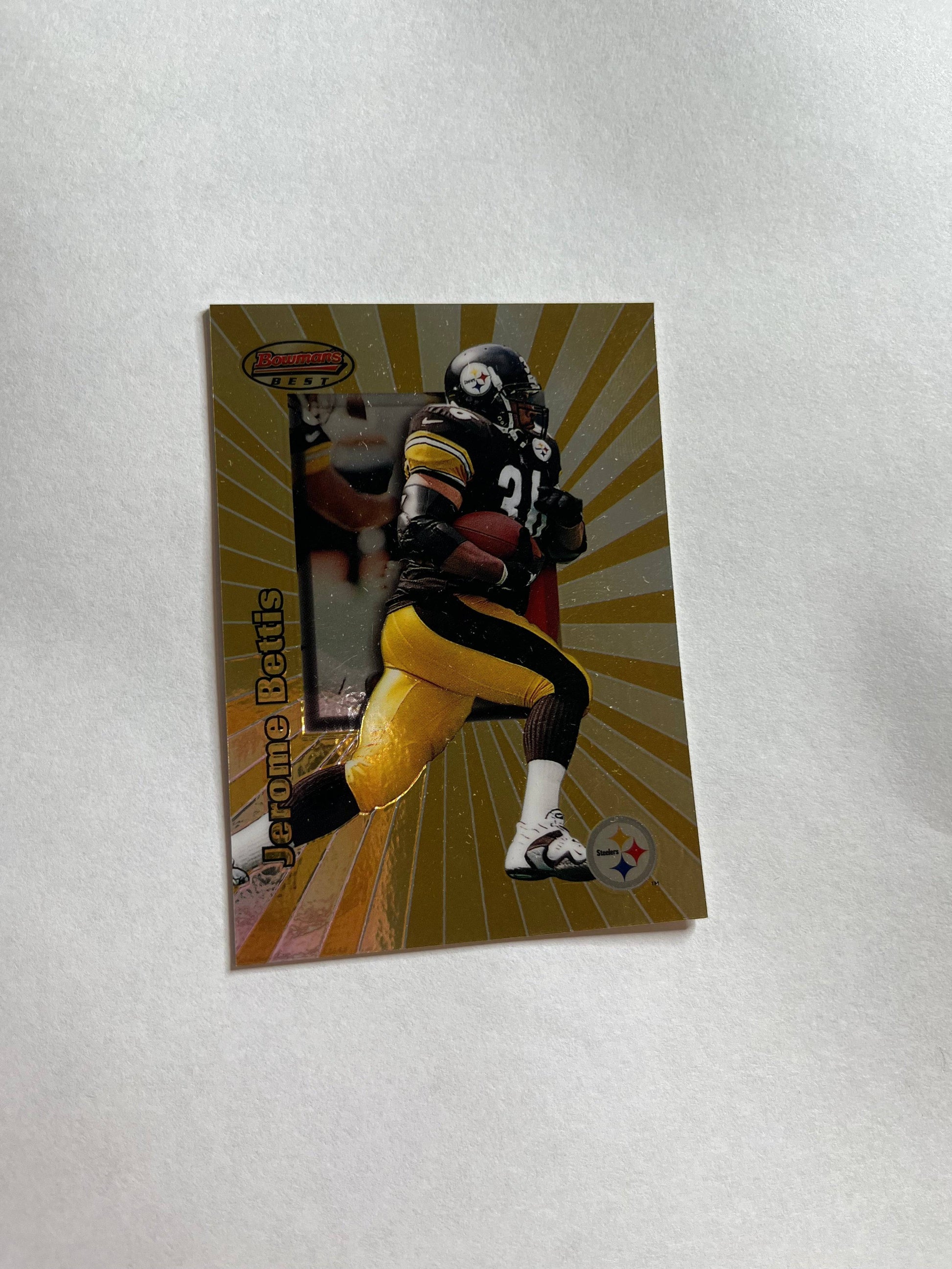 1998 Bowman’s Best Jerome Bettis football card showing running back in Steelers uniform with gold background rays